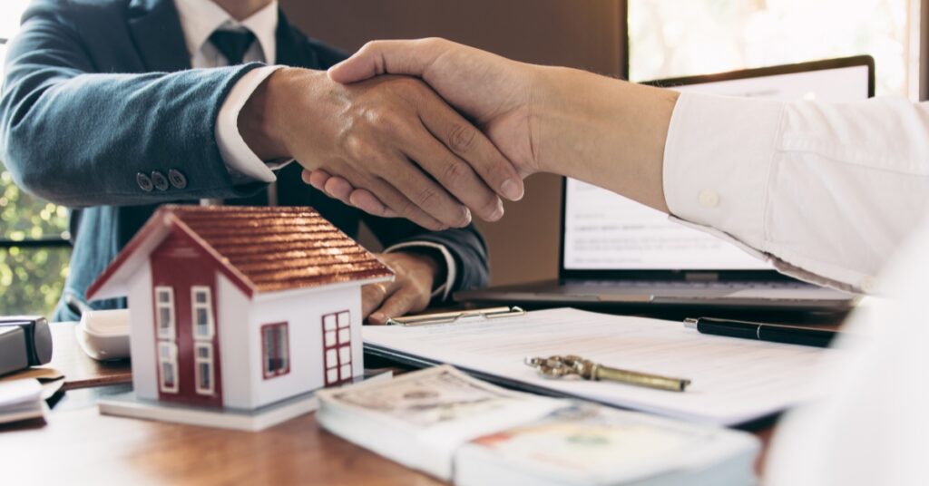 woman shaking hands with the social landlords